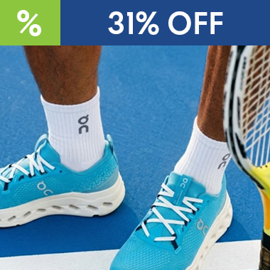 Graphic, person wearing bright blue ON Cloudsurfer Max running shoes with white On‑logo socks standing on blue tennis court with racket nearby, ON FOOTWEAR Cloudsurfer Max Select Colors now just $125.00 - 31% OFF