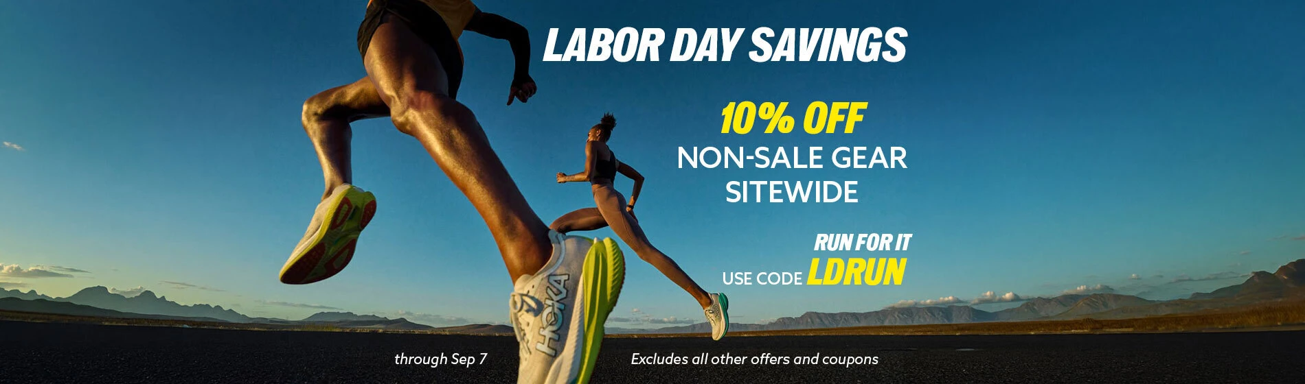 Graphic, two runners mid‑stride on open road with mountains and clear sky behind, text, Celebrate LABOR DAY with 10% Off Non‑Sale Gear Sitewide – Use Code LDRUN through Sep 7 