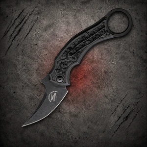 Bastinelli Mako Black Stonewashed Bohler N690 Black Bronze Skull Relief Folding Karambit shown open with pocket clip side visible
