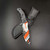 Falcon Orange and White 440 Black ABS Bayonet Knife KC165WO shown next to its protective nylon sheath