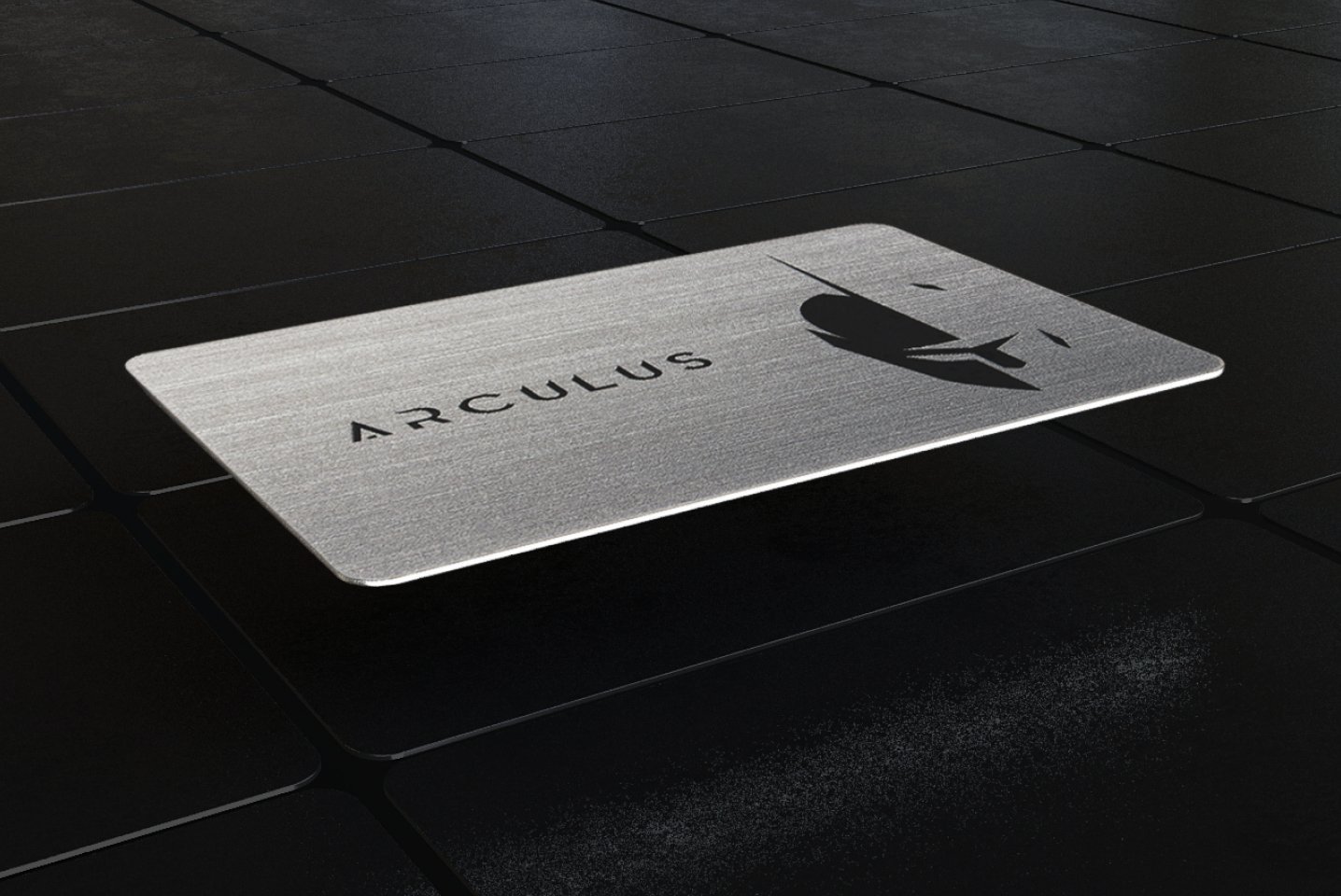  An image of a silver Arculus card with a black, geometric background