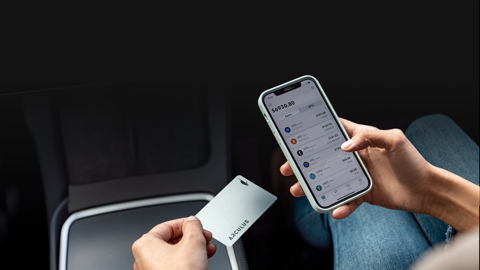 Hand tapping the Arculus metal card to a smartphone displaying the Arculus wallet app