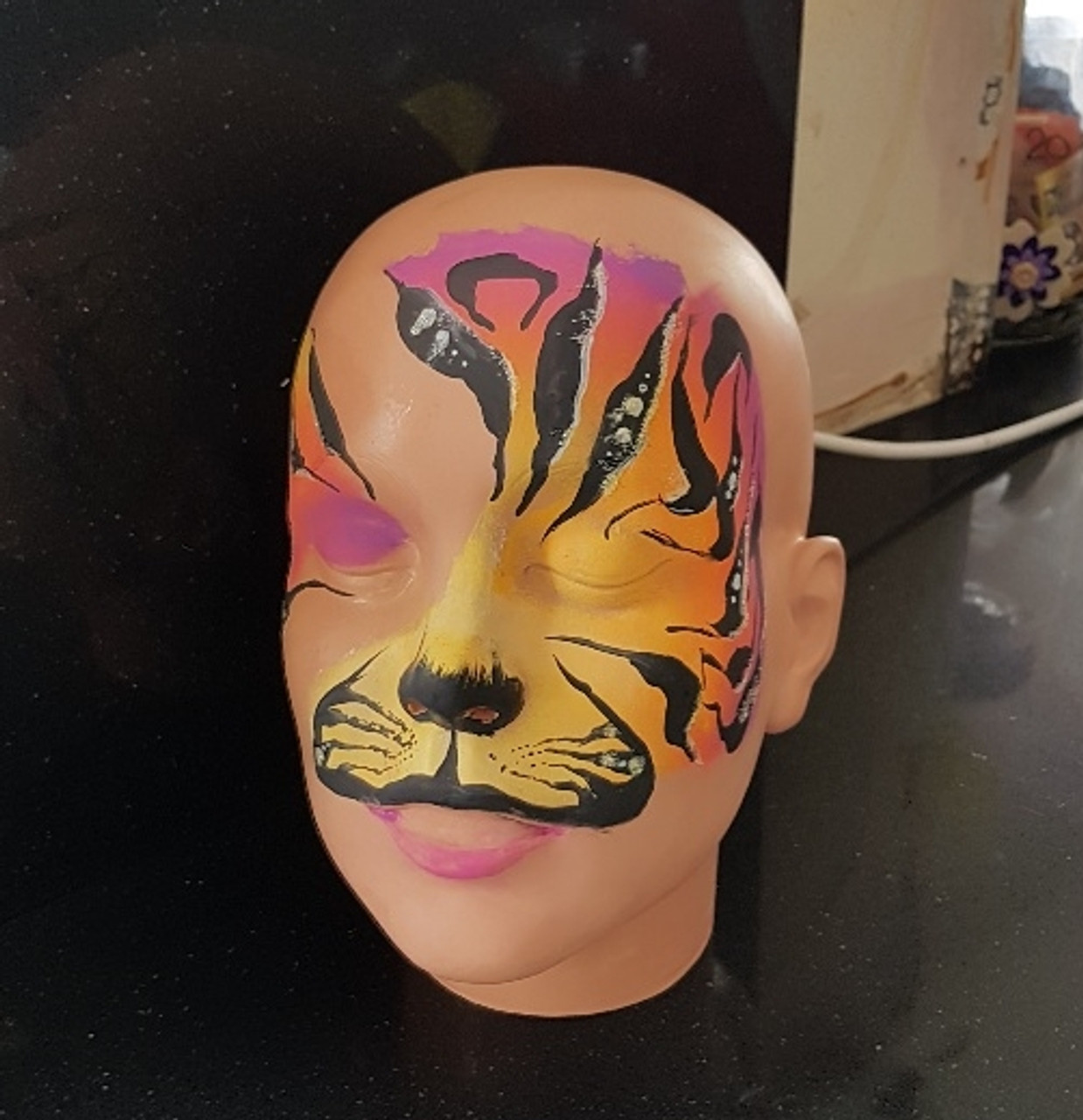 TAG sunset facepaint ideas, A face paint: arm/cheek