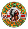Musgo Gasoline neon-style round metal sign 18 inches with green MUSGO lettering, orange background and feathered headdress portrait