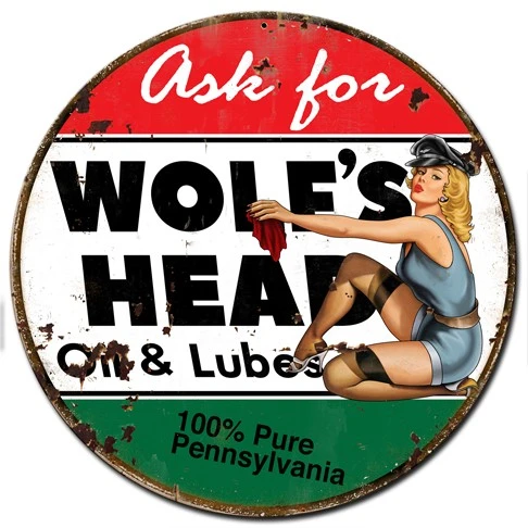 Wolf's Head Oil and Lubes pin-up girl metal sign 24 x 24 inches with blonde in blue outfit, red white green background and black lettering