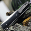 Boker Plus Urban Trapper G10 01BO732 back view highlighting the titanium framelock and slim deep-carry pocket clip.
