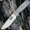 The ESEE-4 (ESEE-4P-MB-DT) shown with its 4.50-inch 1095 plain edge drop point blade in a Desert Tan finish and tall flat grind, tan Micarta handle scales, and its injection-molded OD Green polymer sheath with MOLLE back mounting.