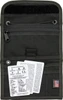 The Izula Gear Passport Case (ESEE-PASSPORT-B-X) in black nylon, shown as a tri-fold case with multiple interior pockets, a zippered pocket with hidden money flap, a Velcro closure, and grommet holes for a paracord neck strap. The Fisher Space Pen is not included.