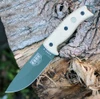 The ESEE-5 (ESEE-5P-KO-OD-E) shown with its 5.25-inch 1095 saber ground drop point blade in an OD Green finish, sharpened glass breaker pommel, fire-making bow drill divot, and tan Micarta handle scales. This is a knife-only listing — no sheath is included.