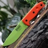 The ESEE-5 (ESEE-5P-VG) shown with its 5.25-inch 1095 saber ground drop point blade in a Venom Green finish, sharpened glass breaker pommel, fire-making bow drill divot, orange G-10 handle scales, and its black Kydex belt sheath.