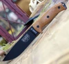 The ESEE-6 3D Handle (6PB-011) shown with its 6.50-inch 1095 plain edge drop point blade in a black finish and flat grind, 3D natural canvas Micarta handle scales with finger choil, and its injection-molded black plastic sheath.