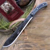 The Expat Darien Machete (ESEE-DARIEN) shown with its 12.38-inch 1075 plain edge drop point blade in a black oxide finish and flat grind, black Micarta handle, and its khaki canvas sheath.