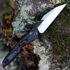 Kershaw Launch 13 being deployed via push button showing the integrated lanyard hole and slim deep-carry clip.
