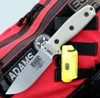 The ESEE-4 (ESEE-4P35V) shown with its 4.5-inch CPM-S35VN drop point blade in a stonewash finish and flat grind, tan Micarta handle scales, and its injection-molded black polymer sheath.