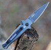 Kershaw Launch 12 being deployed via push button showing the integrated finger guards and reversible pocket clip.
