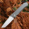 Chris Reeve Umnumzaan UMN-1002 open — CPM MagnaCut stonewash tanto blade, gray titanium handle, modified Reeve Integral Lock