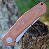 Kershaw 4020MIB Concierge highlighting the brown canvas micarta scales and custom shield pivot detail.