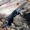 Kershaw Leek Damascus being deployed showing the SpeedSafe flipper and slim profile.