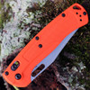 Orange Grivory handle scales on Benchmade Taggedout lightweight hunting knife