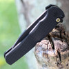 The Pro-Tech Malibu Flipper , Blade SHow Atlanta 2023 (5306) - 3.5" DLC Black Magnacut Wharncliffe Plain Blade, Black Textured Aluminum Handle, Mosiac Button Lock