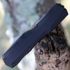 Close-up of the black-anodized 6061-T6 aluminum handle and staircase-style thumb slide on the Kershaw 9000.