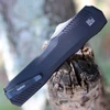 Close-up of the black-anodized 6061-T6 aluminum handle and staircase-style thumb slide on the Kershaw 9000.