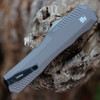 Detailed close-up of the gray-anodized aluminum handle and the staircase-textured thumb slide on the Kershaw 9000GRY.