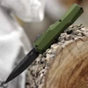 Kershaw Livewire 9000OLBW OTF automatic knife open view showing the 3.3-inch BlackWash MagnaCut blade and olive green handle.