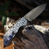 Pro-Tech Strider PT+ 2024 Custom (PT+2024.001) 3.0in  Chad Nichols Damascus Drop Point Plain Blade, 2 Tone DLC/Satin 17-4 Stainless Steel with Gridlock Pattern, Satin Hardware, Black Lip Pearl Button, Blue Titanium Clip