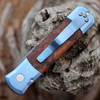 Pro-Tech 2024 Godson Custom 001 - 3.15" Nichols Damascus Spear Point Blade, Orange Peel Finish and Blue Anodized Titanium Frame, Desert Iron Wood Inlays, Mosaic Button, Titanium Clip