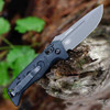 Black G-10 handle scales on Benchmade compact automatic knife