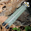 Jade G-10 handles with adjustable tungsten weights on Benchmade flipper