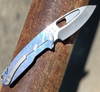 Medford Infraction Framelock (MK0314TQ-37A2-TSCS-BN) 3.6"Tumbled S45VN Drop Point Plain Blade, Blue Titanium Handle, Silver Hardware, Silver Clip, NP3 Breaker