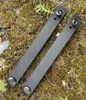 The ESEE Strap Kit 3 (ESEE-STRAPKIT-3), a black horizontal/scout carry strap kit with straight posts and Phillips screws, shown installed on a large Kydex sheath.