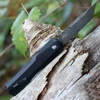 Rear view showing the reversible black deep-carry pocket clip and the textured handle milling.