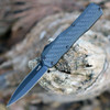 Kershaw Livewire 9000DECF OTF automatic knife open view showing the 3.36-inch black dagger MagnaCut blade and carbon fiber handle.
