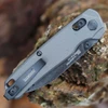 Detailed close-up of the DuraLock crossbar mechanism and thumb studs on the gray Kershaw Bel Air.