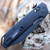 Detailed close-up of the DuraLock crossbar mechanism and black thumb studs on the Iridium 2038RBLK.