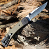 Buck Knives 110 Hunter Sport (110GRS5) 3.75" Satin Clip Point Plain Blade, Olive Drab Green Micarta Handle with Black AluminumBolsters