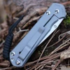 Chris Reeve Sebenza 31 S31-1690 Forever Flag CGG close-up —
                  Stars and Stripes design on glass blasted 6AL4V titanium