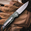 Pro-Tech TR-3 X1 green fish scale in hand, 8 inch overall, 3.9 oz, push button auto knife, back open view