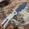 Boker Plus Micro Tracker Folder 01BP0002 partially deployed view showcasing the unique harpoon blade grind and flipper tab.