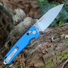 The Kershaw Bel Air Navy Blue being deployed highlighting the KVT ball-bearing pivot and its slim 7.25-inch overall length.
