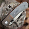 Anodized titanium bolsters and contoured Canvas Micarta handle scales on Resistor