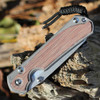 hris Reeve Sebenza 31 L31-1222 natural canvas Micarta inlay close-up — woven textile surface, sandblasted 6AL4V titanium frame, tip-up clip