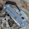 Chris Reeve Small Sebenza 31 S31-1010 blue-anodized thumb lug and backspacer — sandblasted grey titanium, high-contrast CRK hardware detail