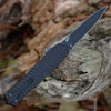 CRKT Xolotl OTF Auto 5335 profile view showing 3.50 inch MagnaCut black double-edge dagger blade and sculpted black aluminum handle.