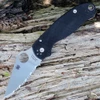 The Spyderco Para 3 C223GS is shown open. The tumble-finished, fully serrated clip point blade with a Trademark Round Hole extends from a black textured G-10 handle.