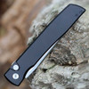Close-up of the slim black aluminum handle featuring the subtle Boker and Zinker logos.