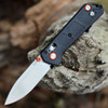Boker Plus Kihon Compact 01BP0037 showing the black GFN handle and orange anodized accents.